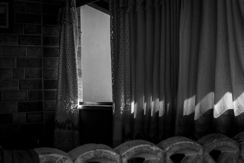 dark motel room window